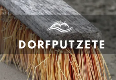 Dorfputzete – Nahaufnahme eines Straßenbesens
